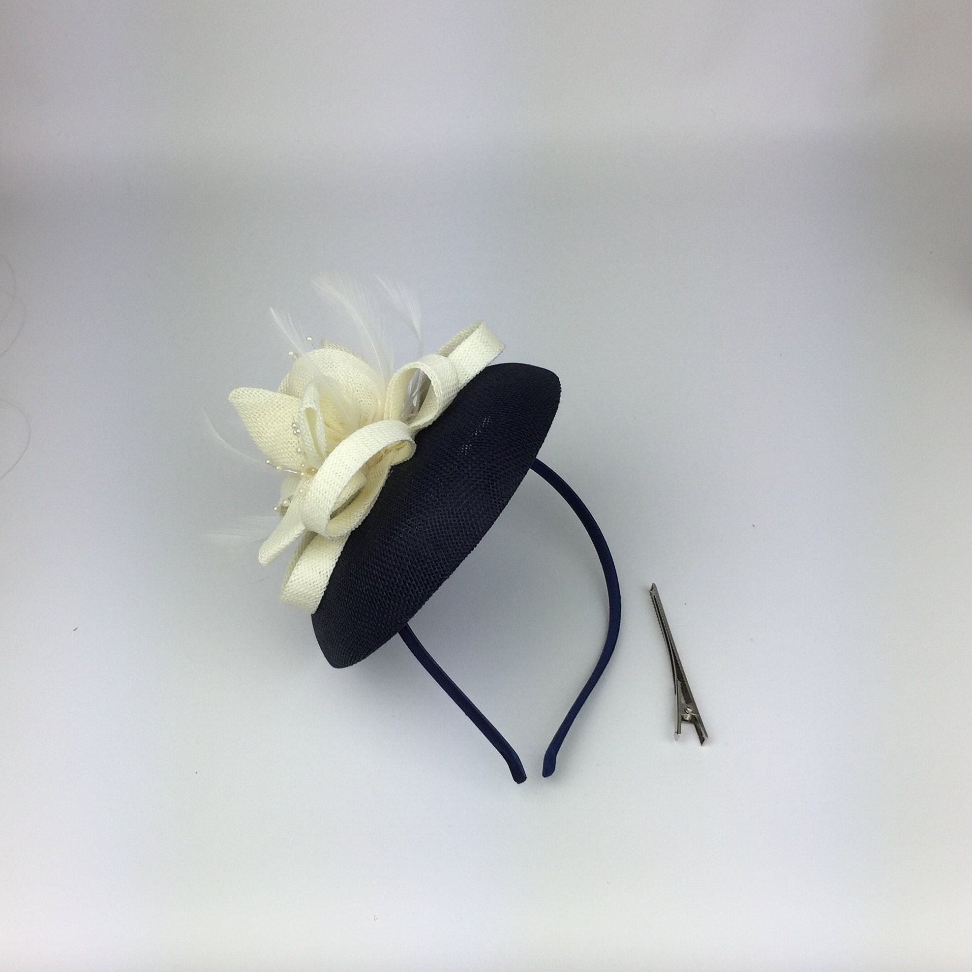 Black and cream store hats and fascinators