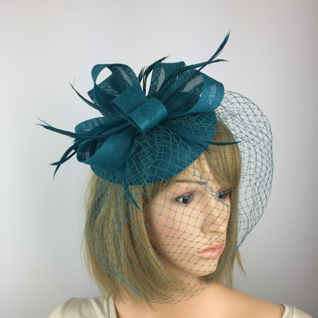 New turquoise fascinator with 2024 white netting and barb quills on a headband! Made to order!